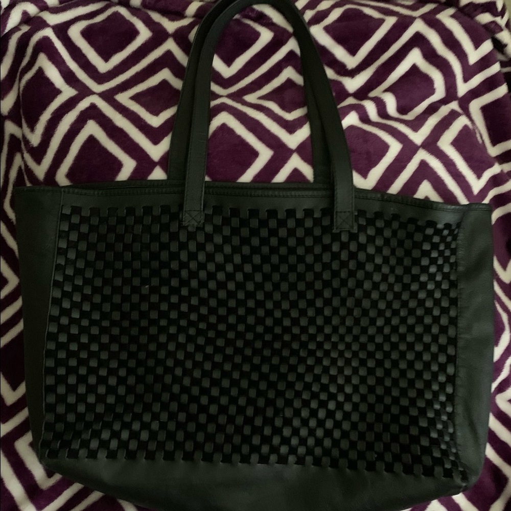 Daph brand, 100% leather tote bag w/ suede and a woven leather design on front.
